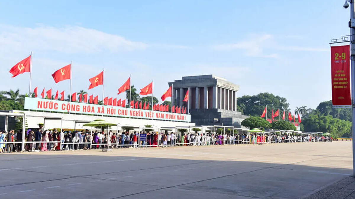 Visitors queuing in a double line to enter Ho Chi Minh Mausoleum