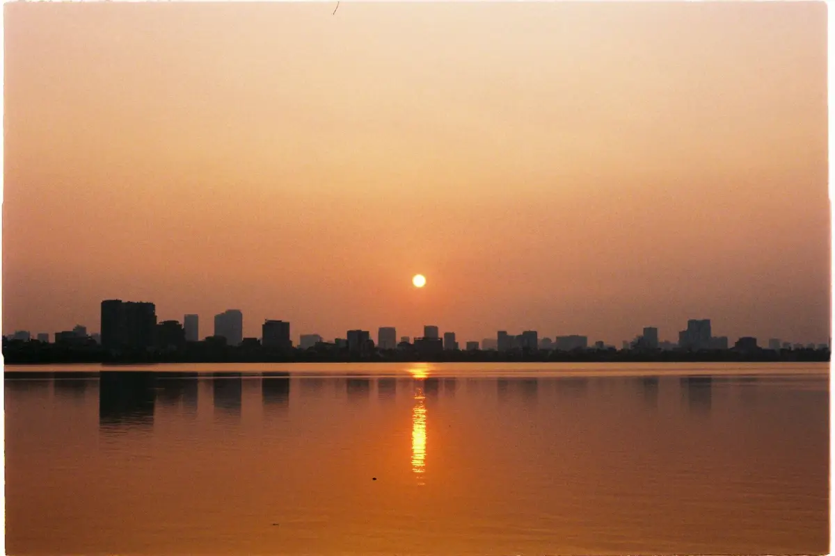 Golden sunset over West Lake and the Hanoi skyline